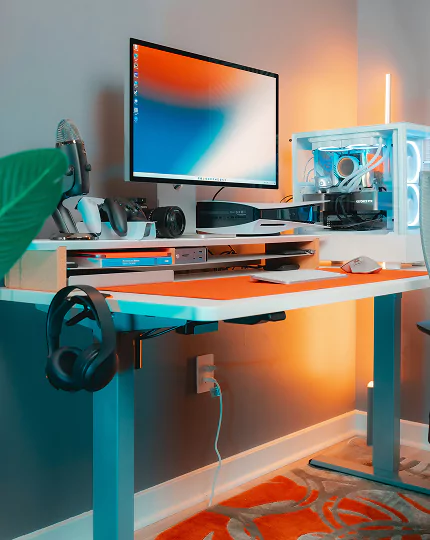 A desk featuring a computer and a monitor