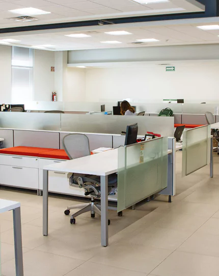 A spacious open office layout featuring desks, chairs